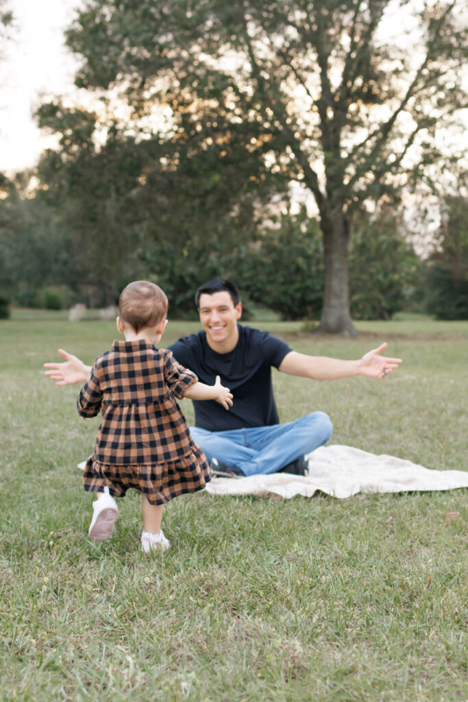 Lifestyle photo of daughter running to dad
