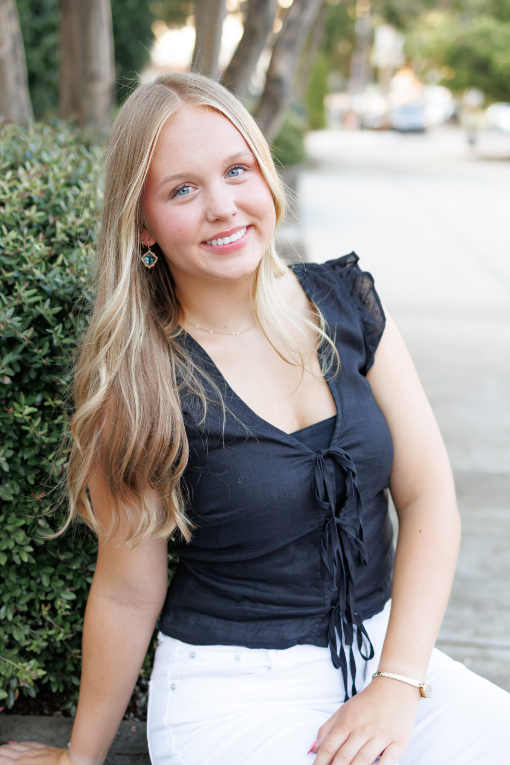 Smiling young woman in casual outfit during senior portraits in Huntsville