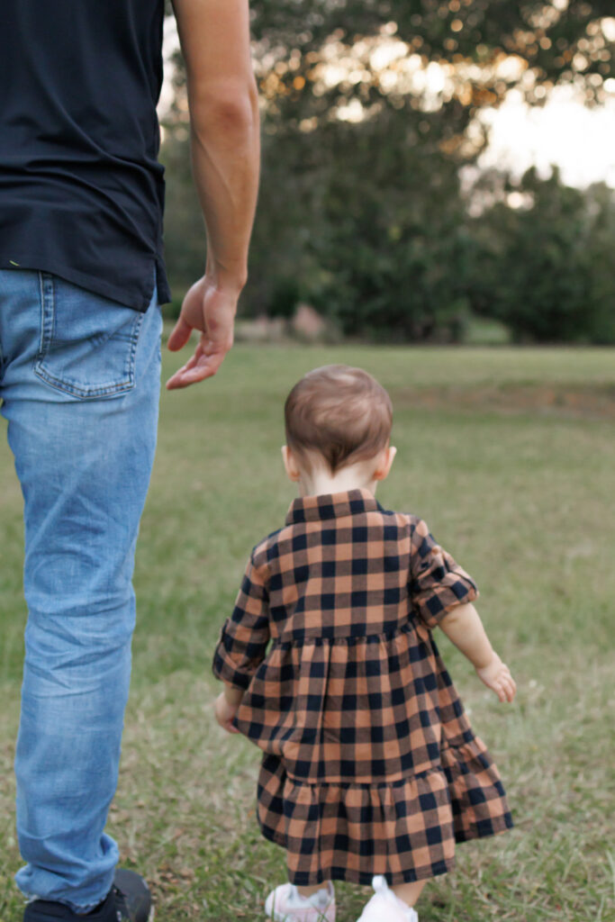 Photo of dad and daughter walking