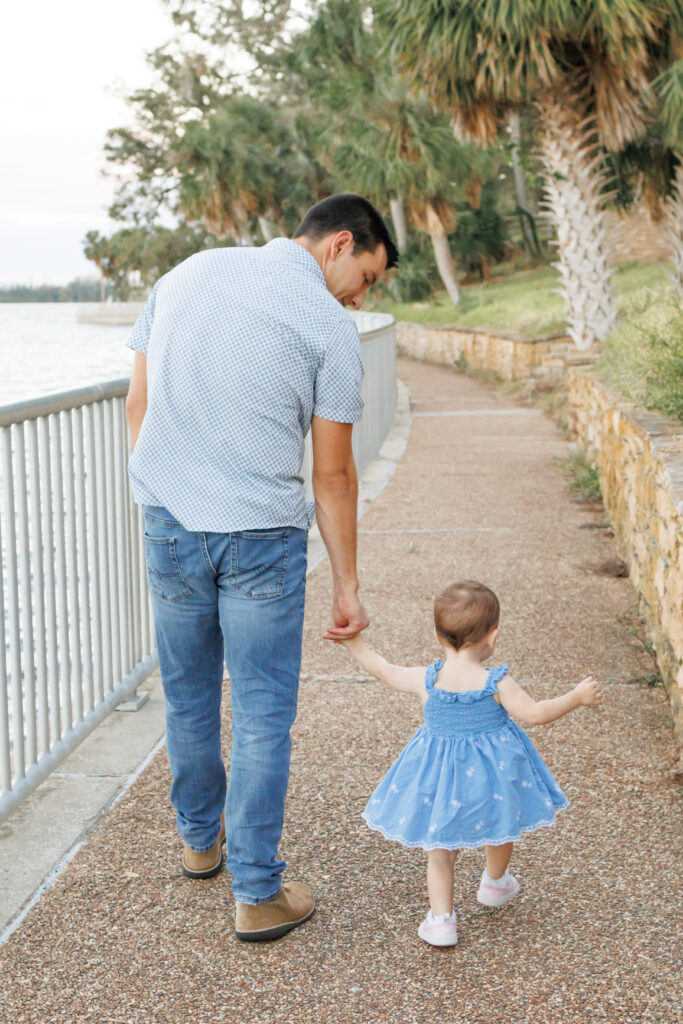 Photo of dad and daughter holding handing